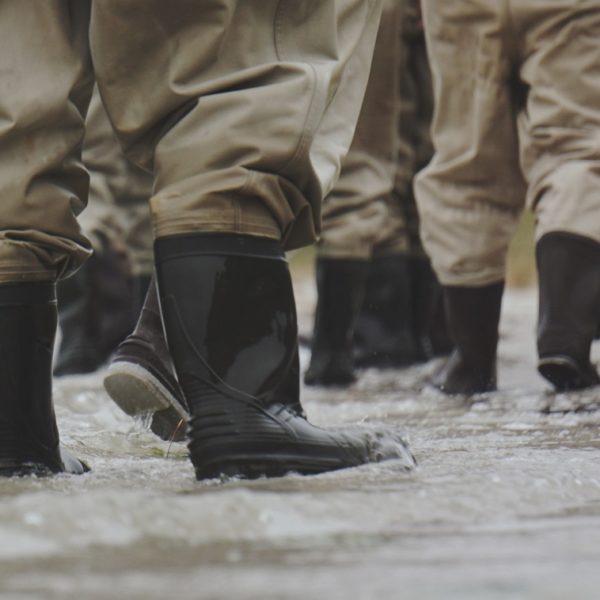 People in waterproof wellingtons as result of flood